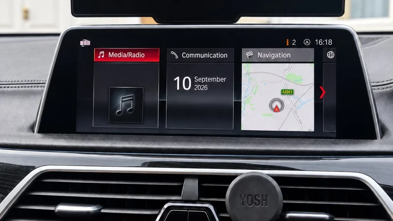BMW iDrive screen showing the stock media and navigation tiles, no CarPlay